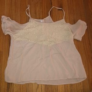 Cream colored open shoulder top